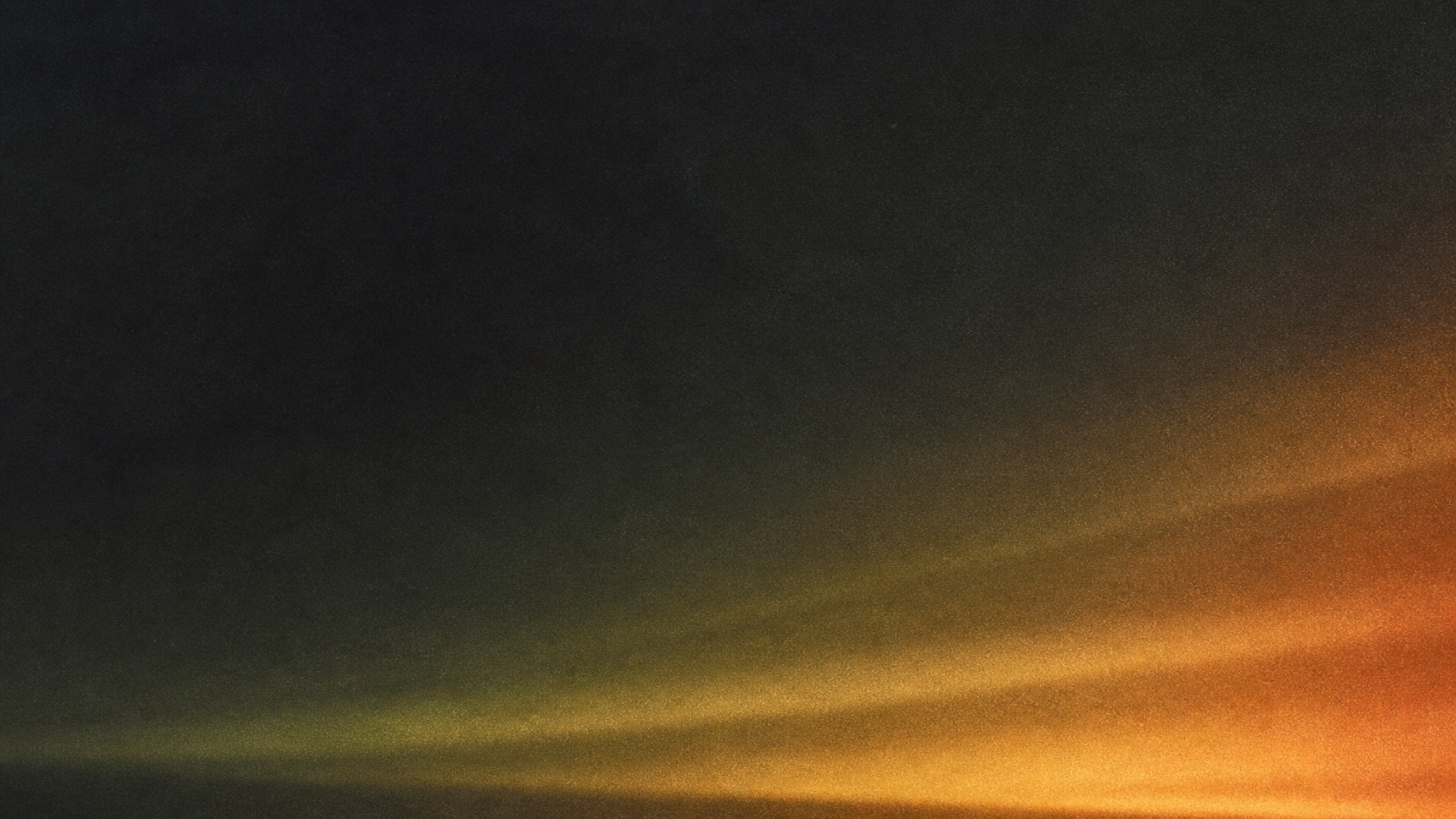 Abstract amber and charcoal light texture for the Technology section